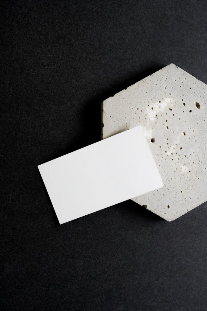 Crafting Captivating Headlines: Your awesome post title goes here Minimalist business card resting on a textured concrete surface, ideal for branding mockups.