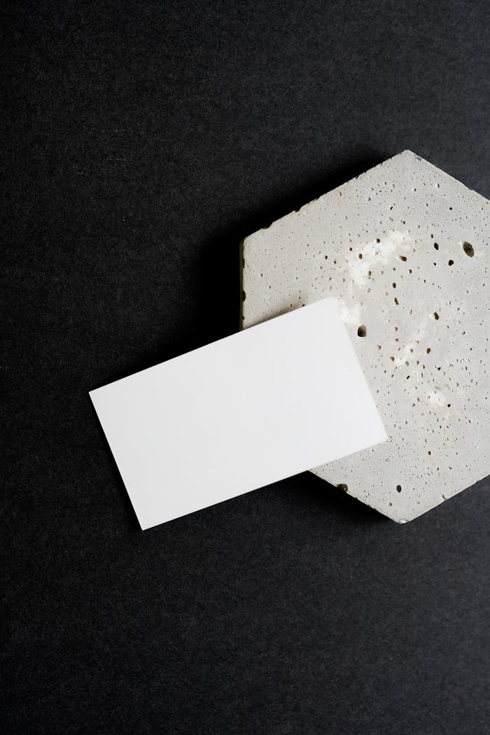 services-05 Minimalist business card resting on a textured concrete surface, ideal for branding mockups.